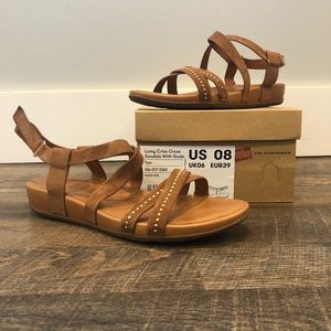 Fit Flop Lumy Criss Cross Sandals when gold accents.